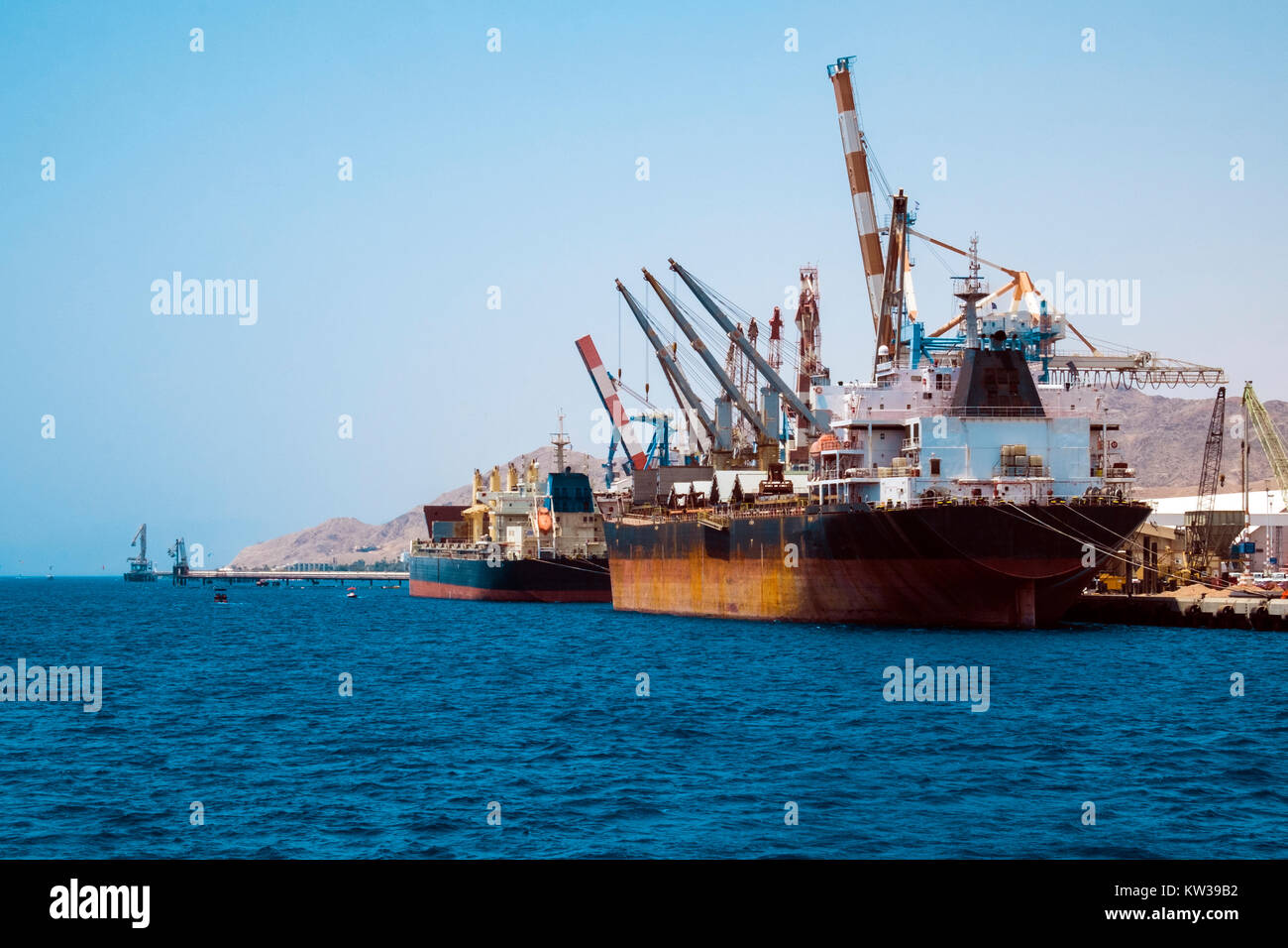 Cargo ships stand in the port of Eilat on the Red Sea (Israel) Stock Photo