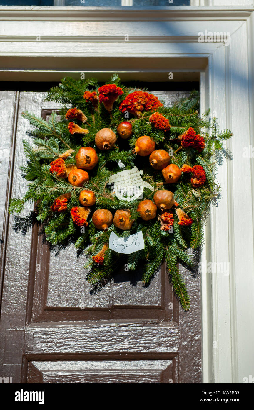 USA Virginia VA Colonial Williamsburg Christmas Holiday wreaths hanging on doors and windows on the Duke of Gloucester Street Stock Photo