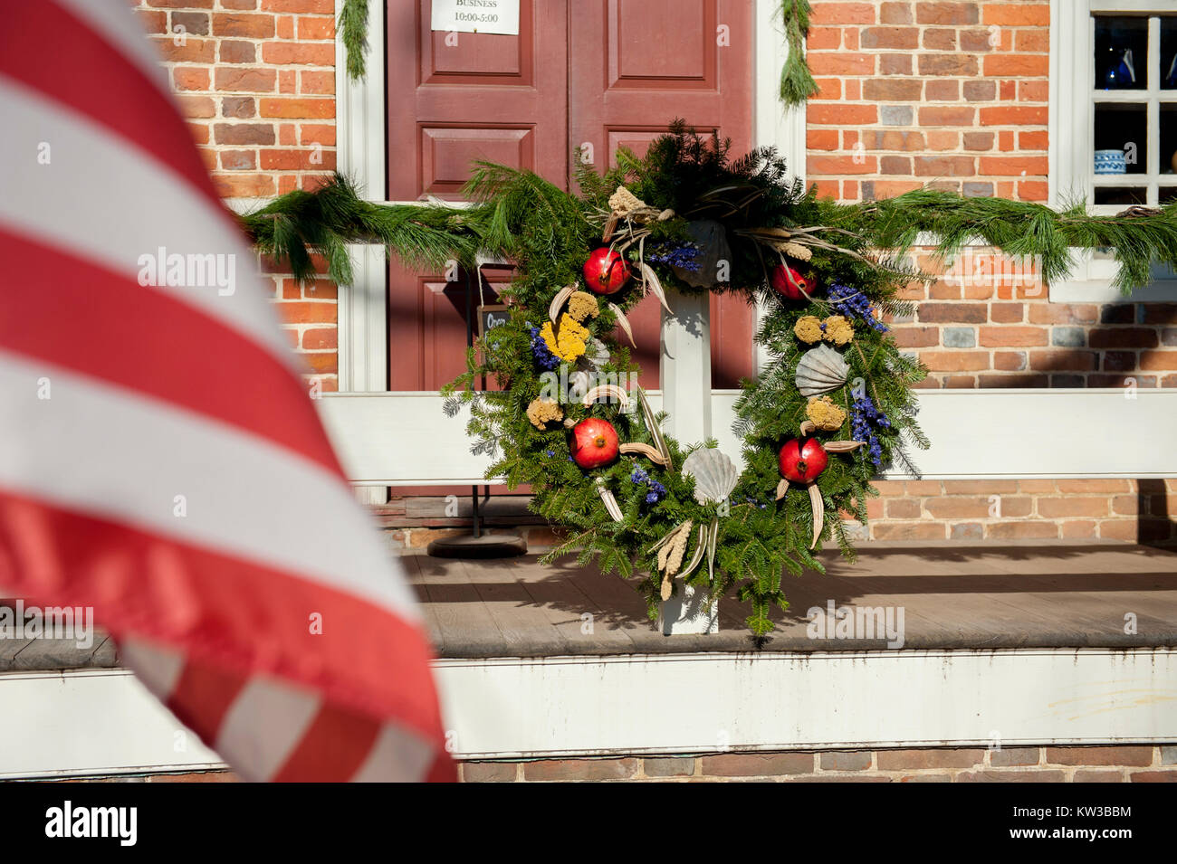 USA Virginia VA Colonial Williamsburg Christmas Holiday wreaths hanging on doors and windows on the Duke of Gloucester Street Stock Photo