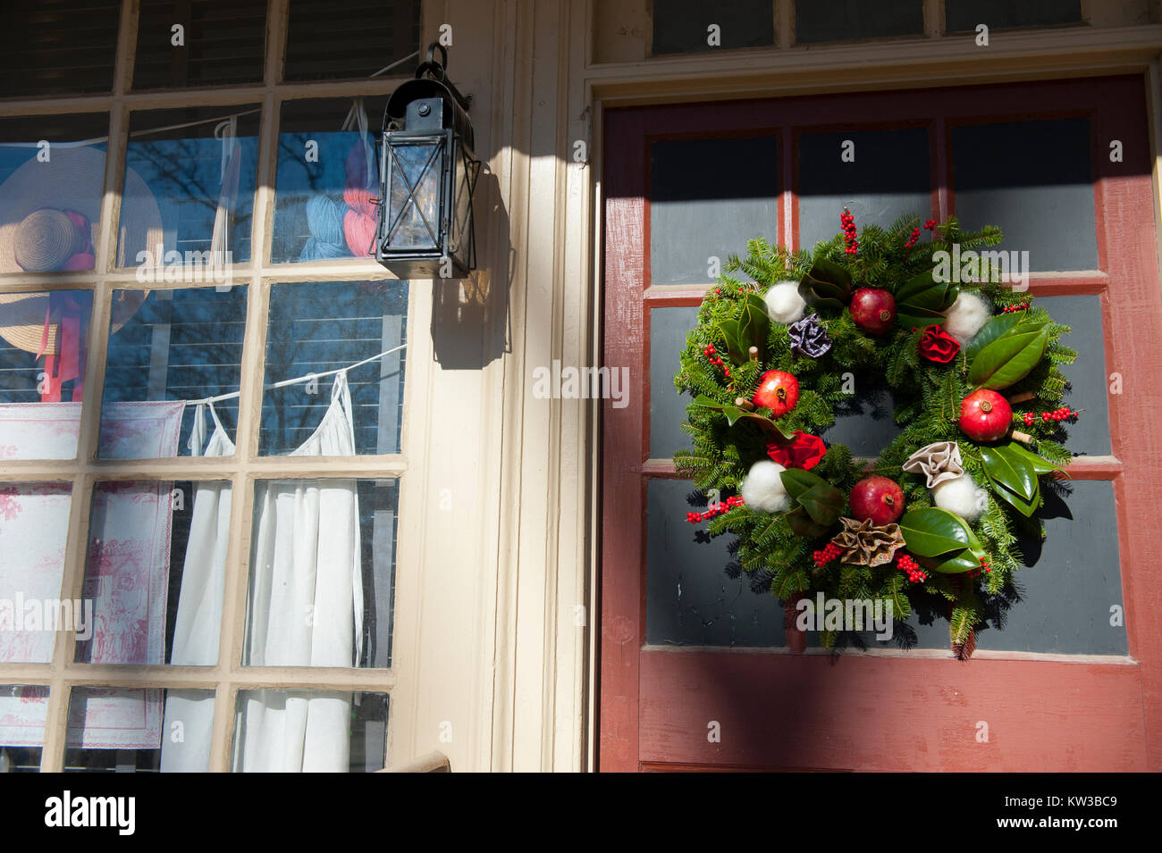 USA Virginia VA Colonial Williamsburg Christmas Holiday wreaths hanging on doors and windows on the Duke of Gloucester Street Stock Photo