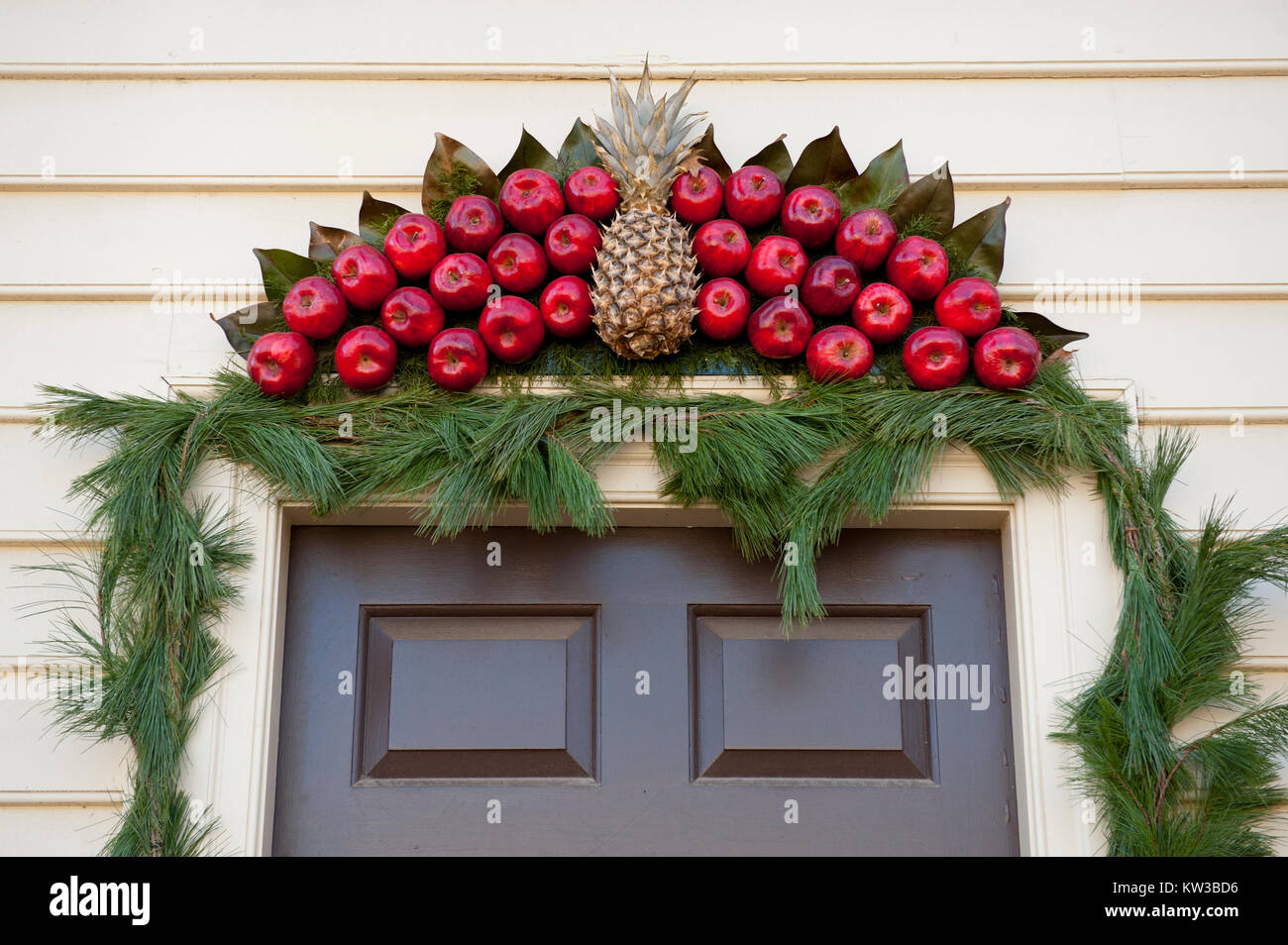 USA Virginia VA Colonial Williamsburg Christmas Holiday wreaths hanging on doors and windows on the Duke of Gloucester Street Stock Photo