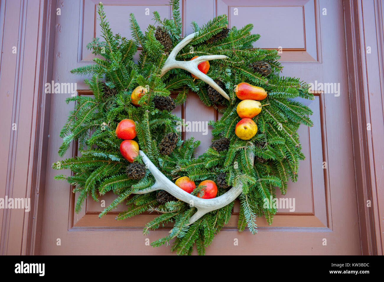 USA Virginia VA Colonial Williamsburg Christmas Holiday wreaths hanging on doors and windows on the Duke of Gloucester Street Stock Photo