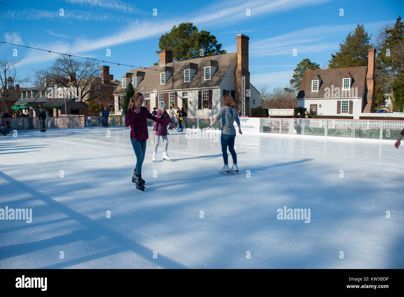 USA Virginia VA Colonial Williamsburg Winter Christmas Ice Skating on a small rink on the Duke of Gloucester Street during the holiday season Stock Photo