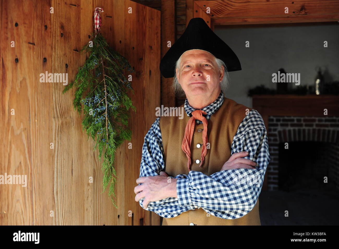 USA Virginia VA Colonial Yorktown American Revolution Museum at Yorktown farm historical interpreter in a doorway of a replica farmhouse Stock Photo