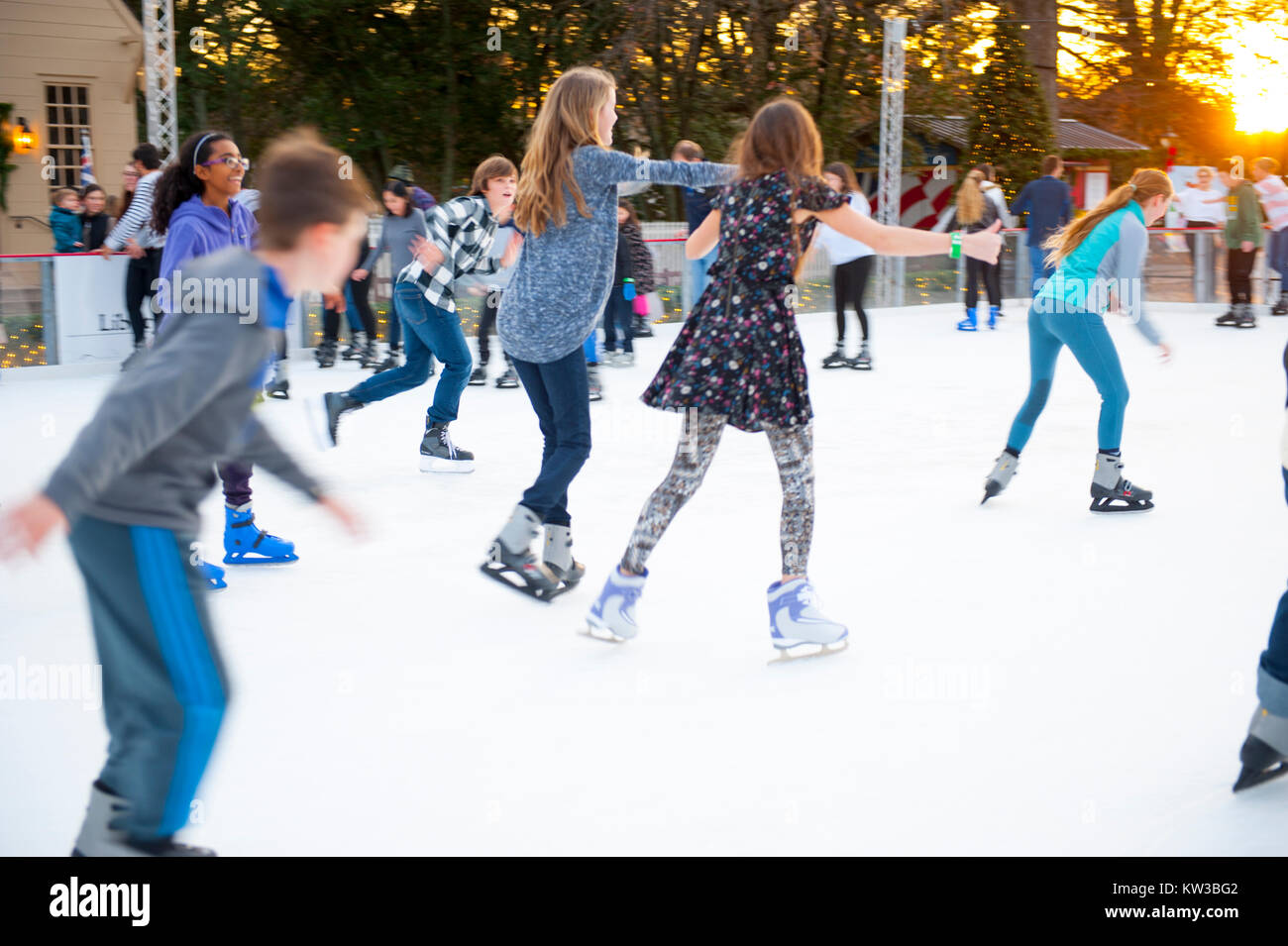 USA Virginia VA Colonial Williamsburg Christmas Winter Holidays Ice Skating on the Duke of Gloucester Street on a temporary rink Stock Photo