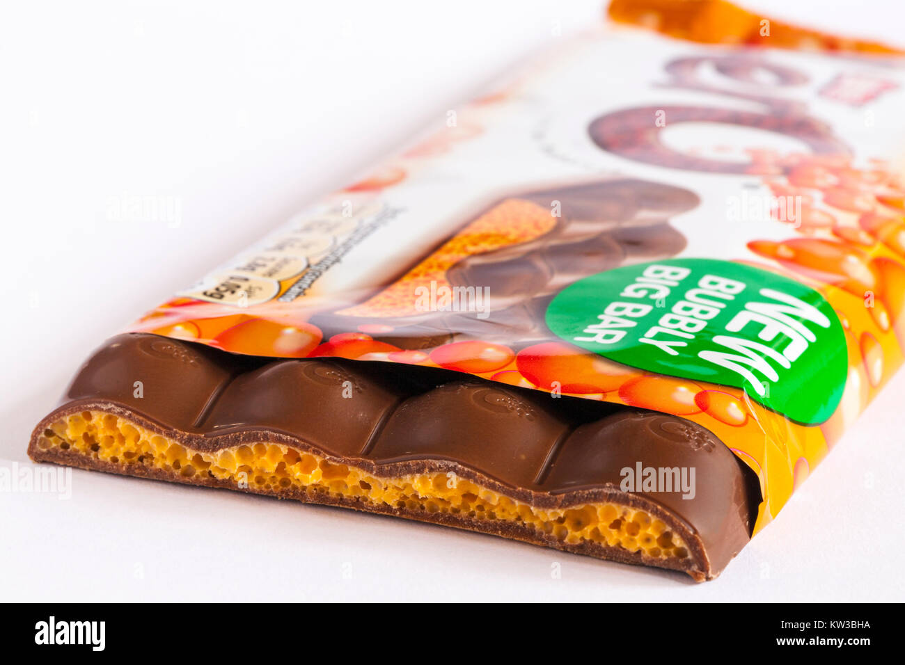 Nestle Orange aero new bubbly big bar of chocolate with piece broken off to see inside set on white background Stock Photo