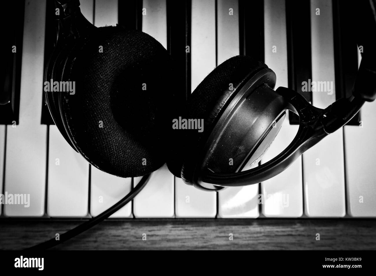 Headphone on piano keyboard Stock Photo Alamy