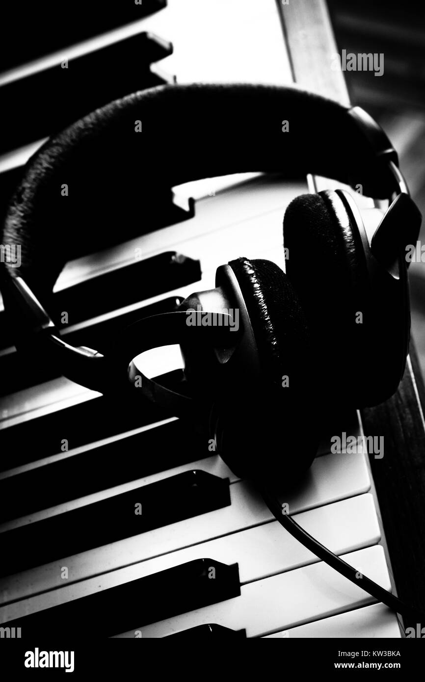 Headphone on piano keyboard Stock Photo Alamy