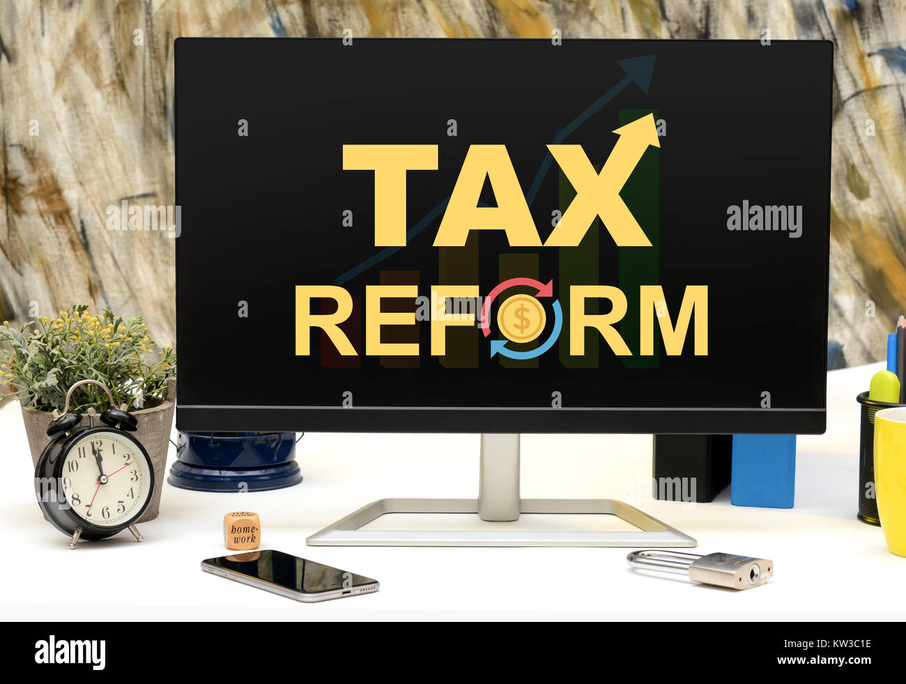 Tax Refors Word Design office table Monitor Display. Stock Photo