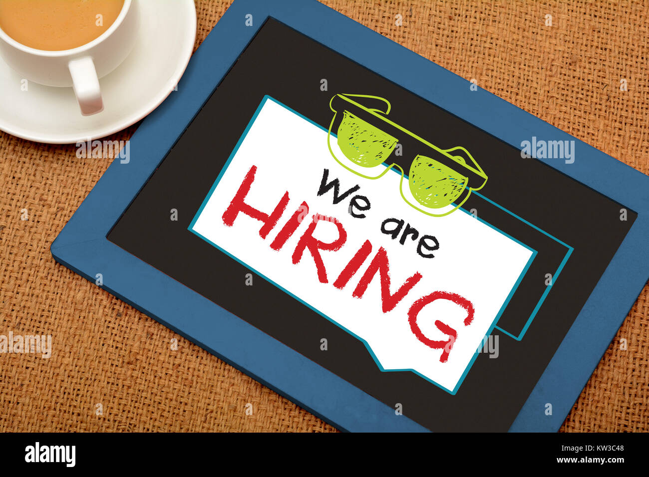 We are hiring drawing on slate with cup of tea Stock Photo Alamy