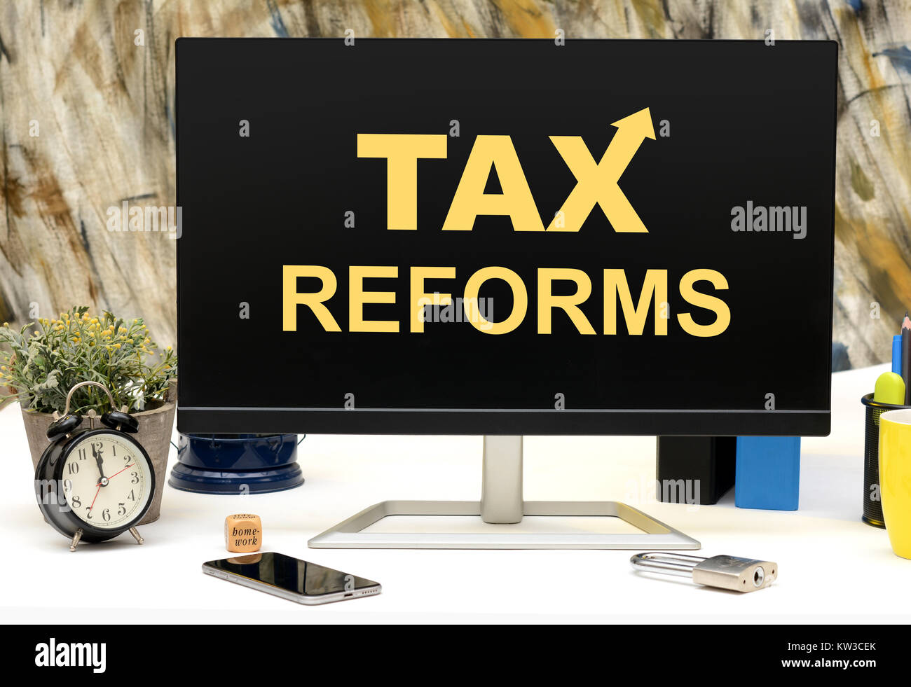 Tax Reforms with arrow going up office monitor. Stock Photo