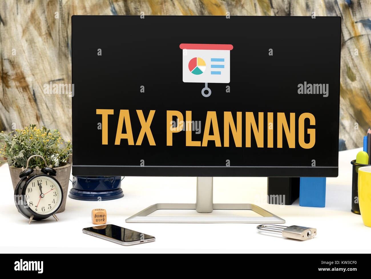 Tax Planning icon on office table monitor. Stock Photo