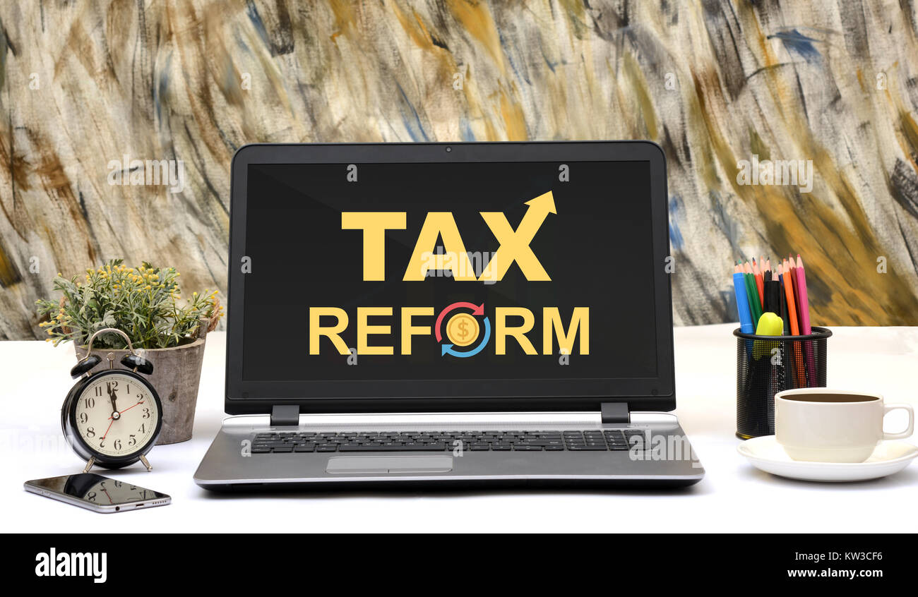 Tax Reforms Word Design office laptop Monitor Display. Stock Photo