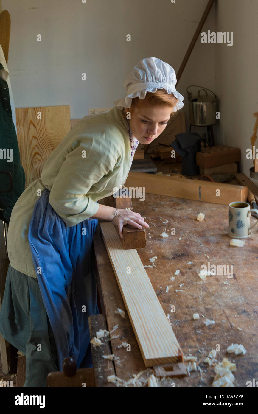 Costumed interpreter at work in the Colonial Williamsburg carpenter shop. Stock Photo