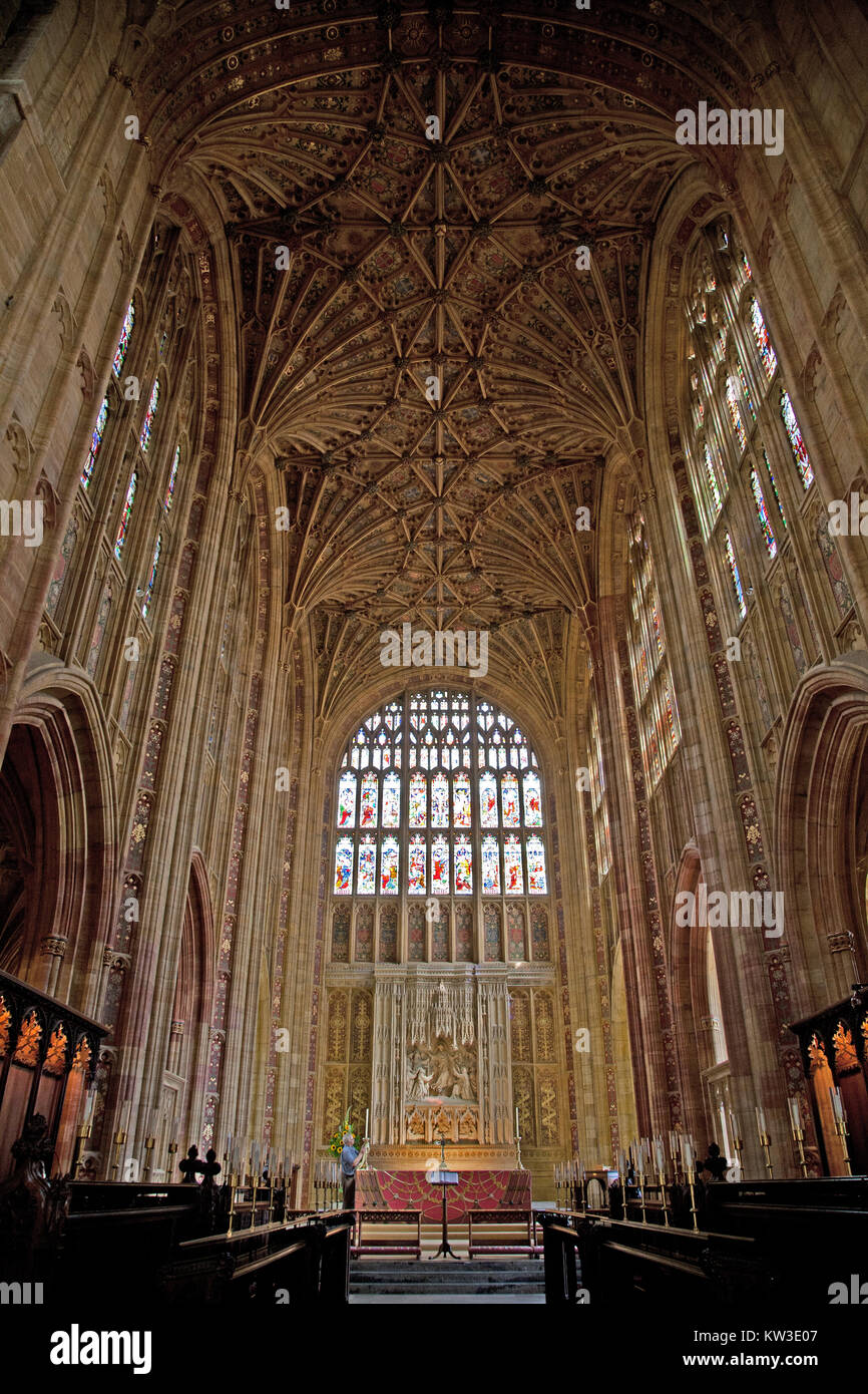 Sherborne Abbey, Dorset, England, showing the fan-vaulted roof, choir stalls and stained glass window. Stock Photo