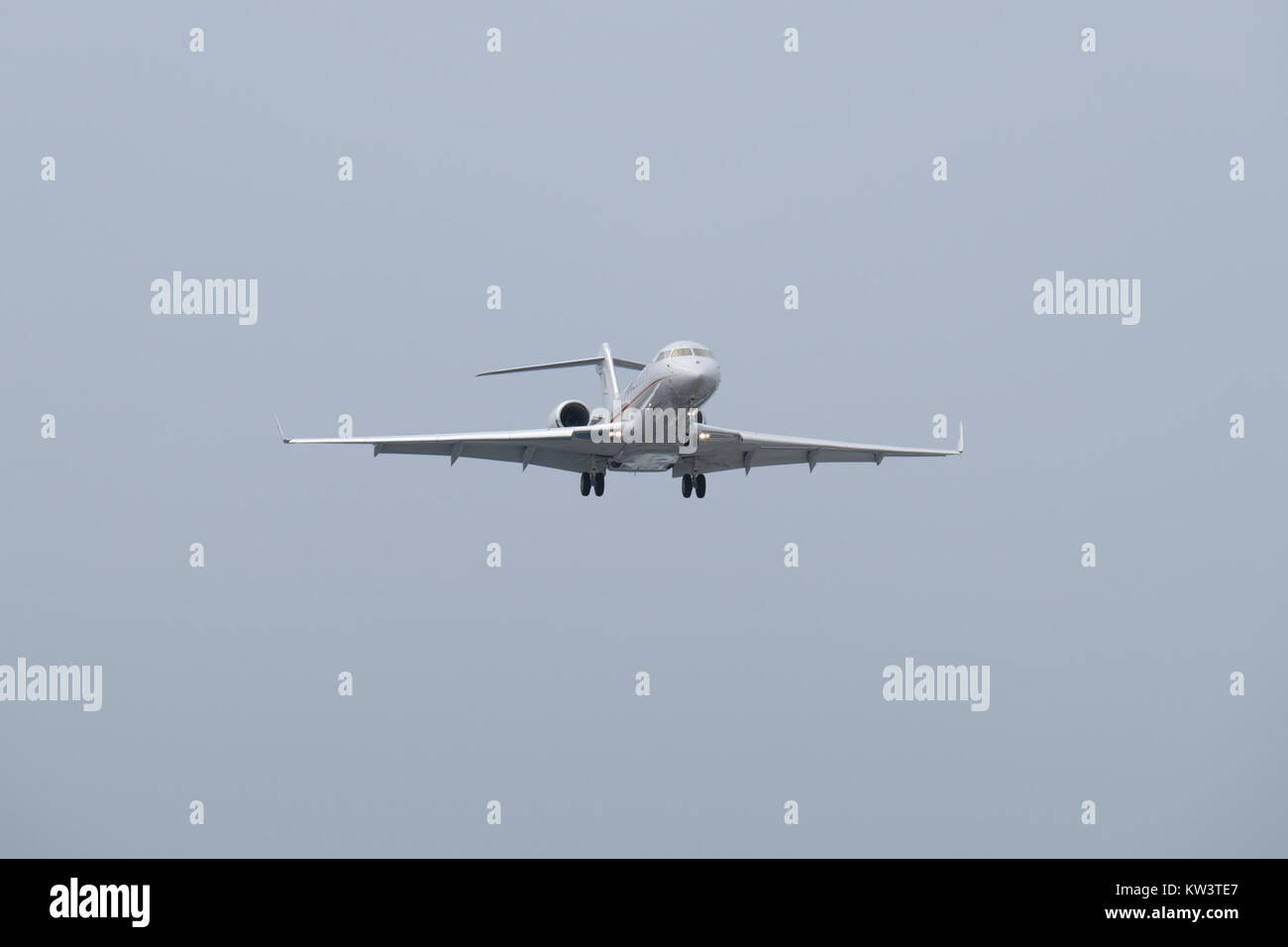 Bombardier Global Express M JGVJ on Final Approach at Taipei Songshan Airport 20150221a Stock Photo