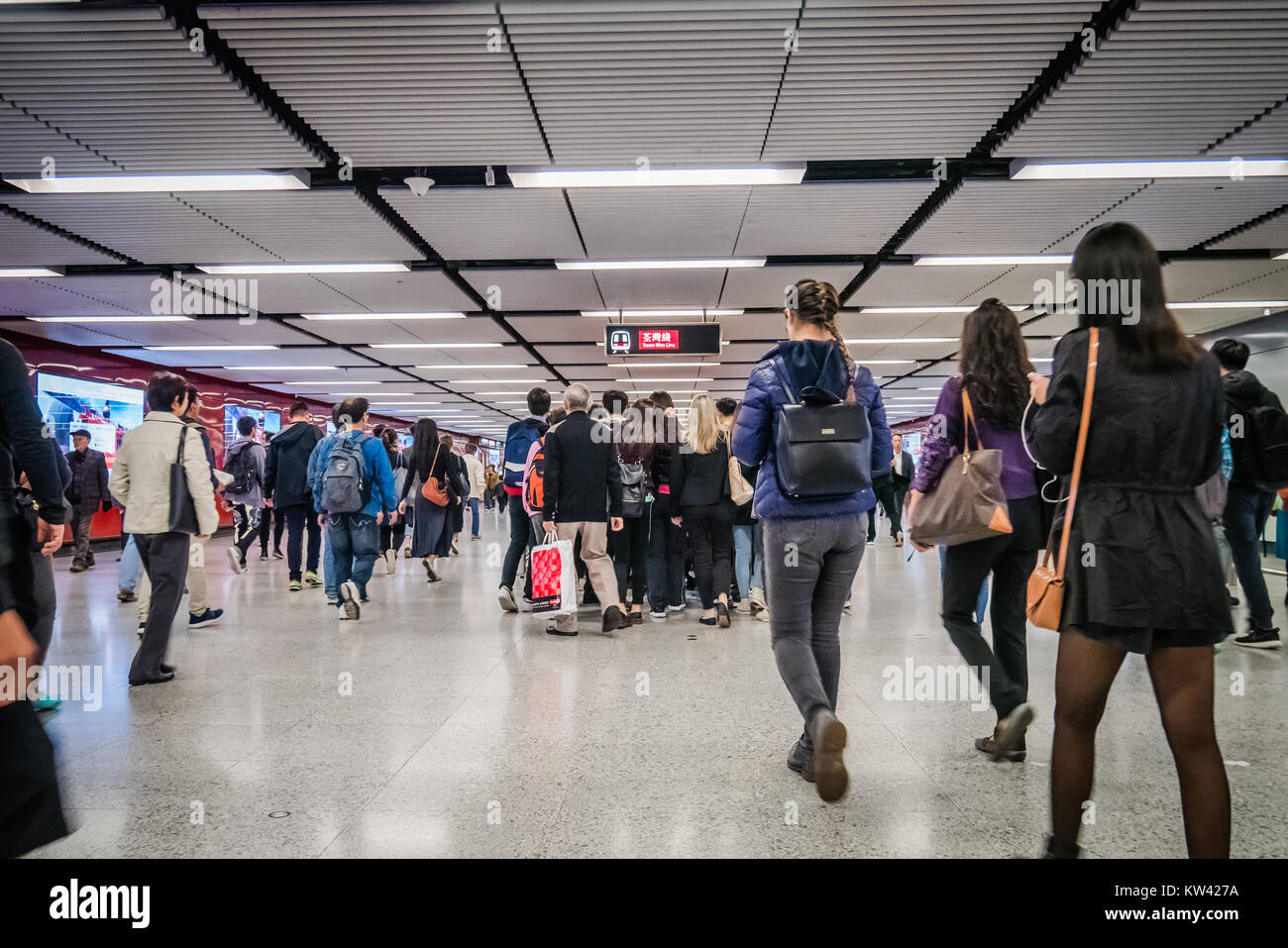 commuters inside a MTR train station in Hong Kong during rush hour Stock Photo