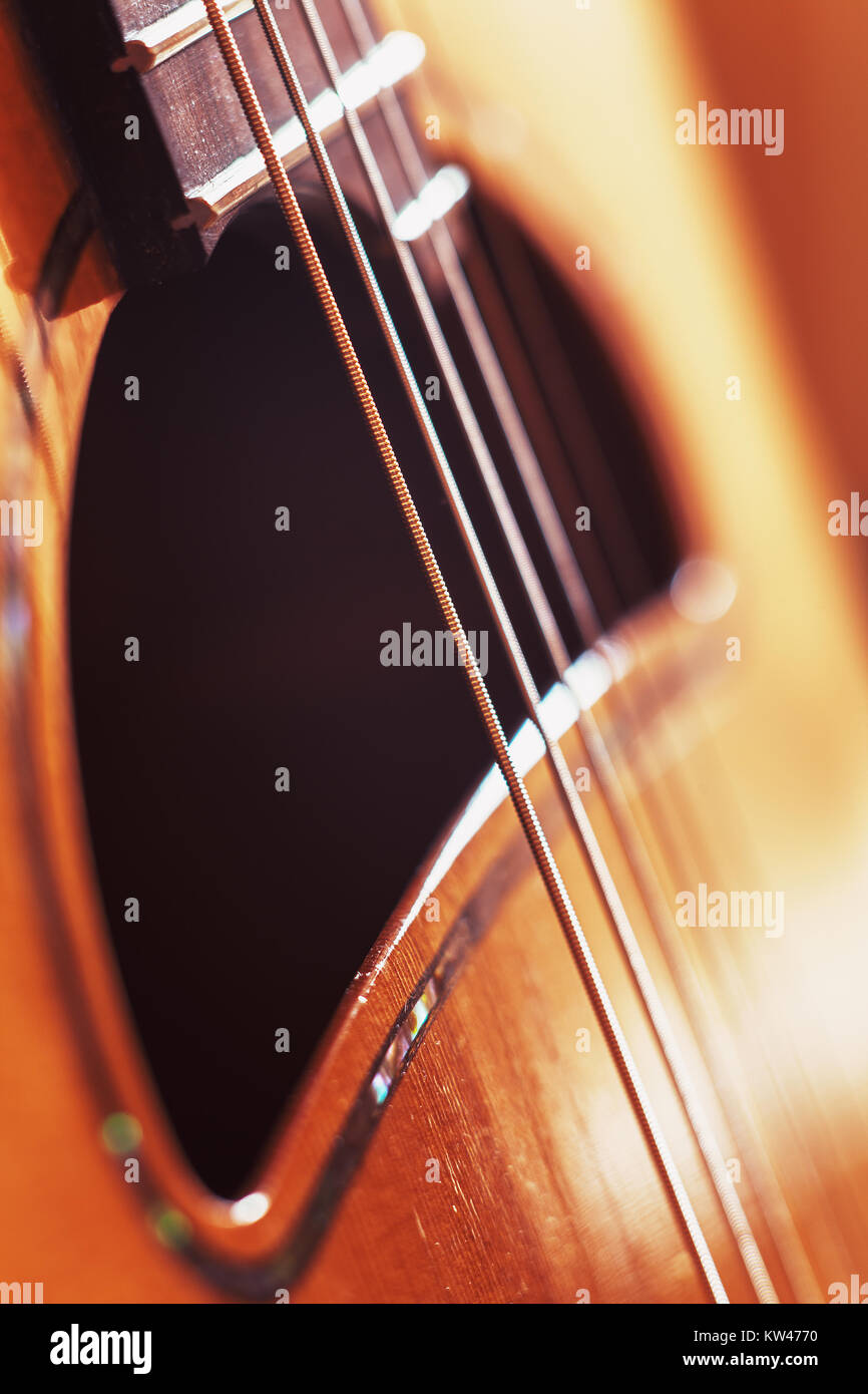 Closeup view of gypsy acoustic guitar, strings and wooden structure details. Stock Photo