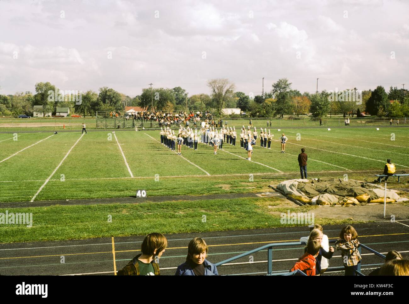 High school marching band performing on a sports field, 1970 Stock
