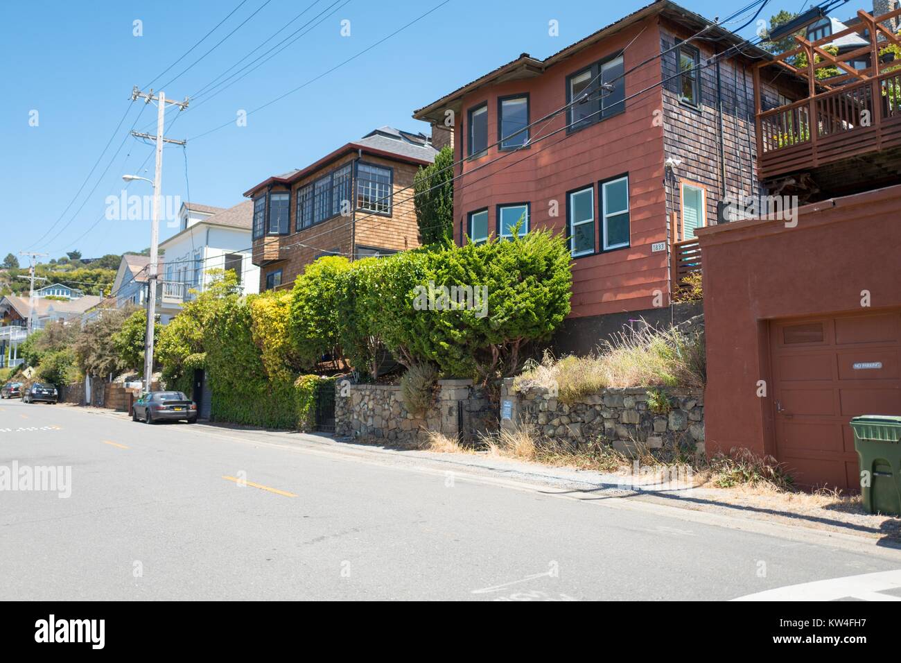 Homes built on a hill on Mar W street above Tiburon, California, 2016. Real estate prices in Tiburon are among the highest in the San Francisco Bay Area, as many homes have views of the city of San Francisco. Stock Photo