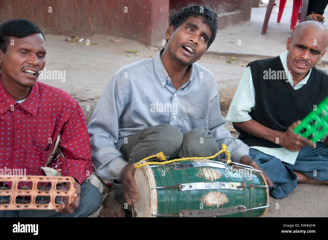 India. Bihar. Bodhgaya,  Blind musicians play at the entrance to the Mahabodhi temple complex. Stock Photo