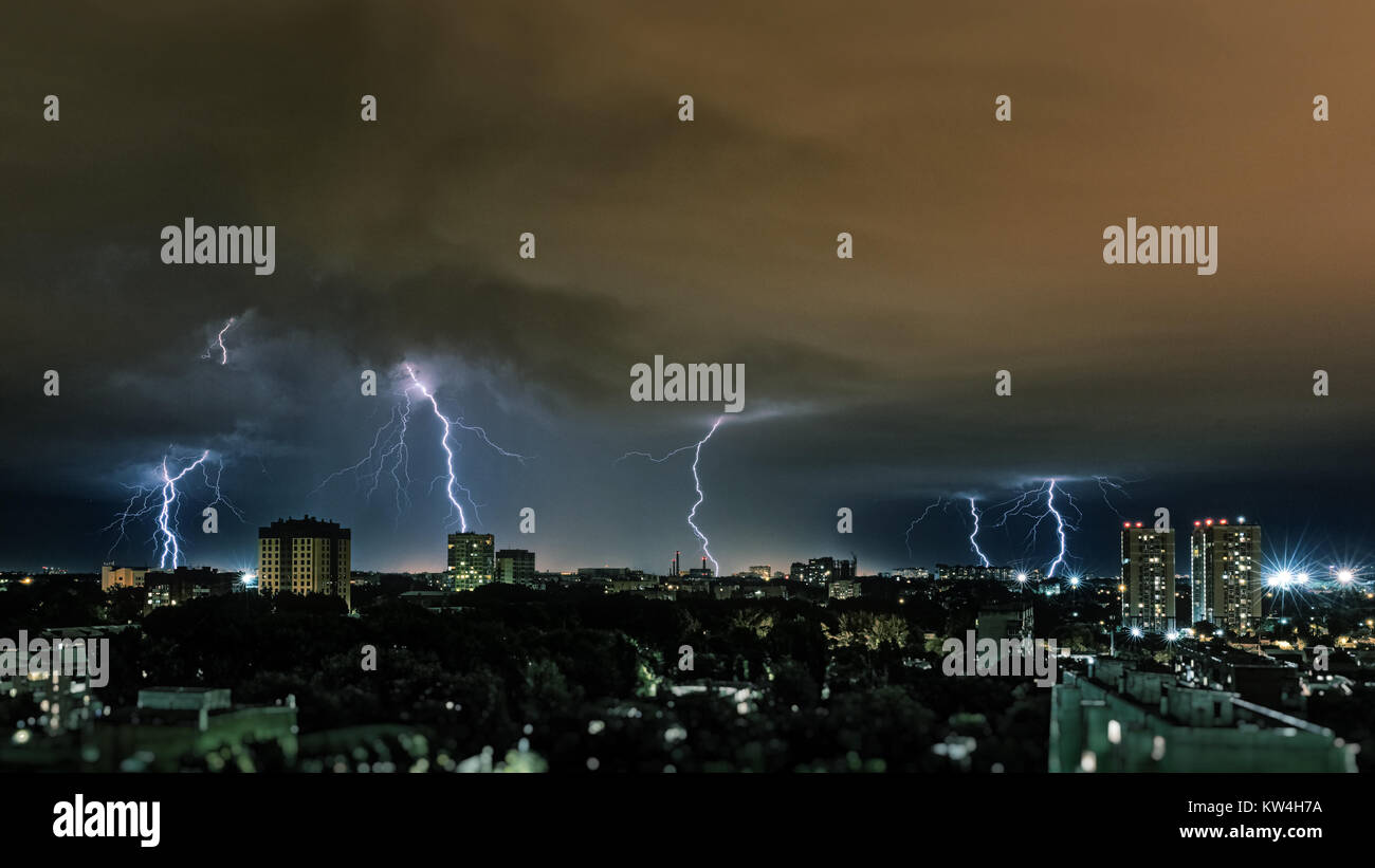 Lightning storm over city, thunderbolt Stock Photo - Alamy