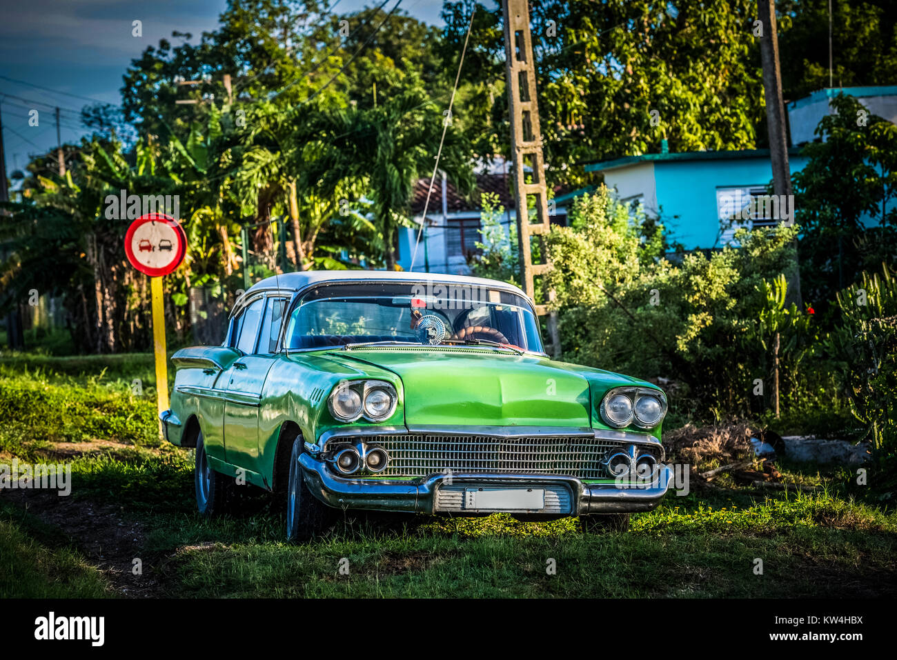 American green Mercury classic car parked on the side strip in Cienfuegos Cuba - Serie Cuba Reportage Stock Photo