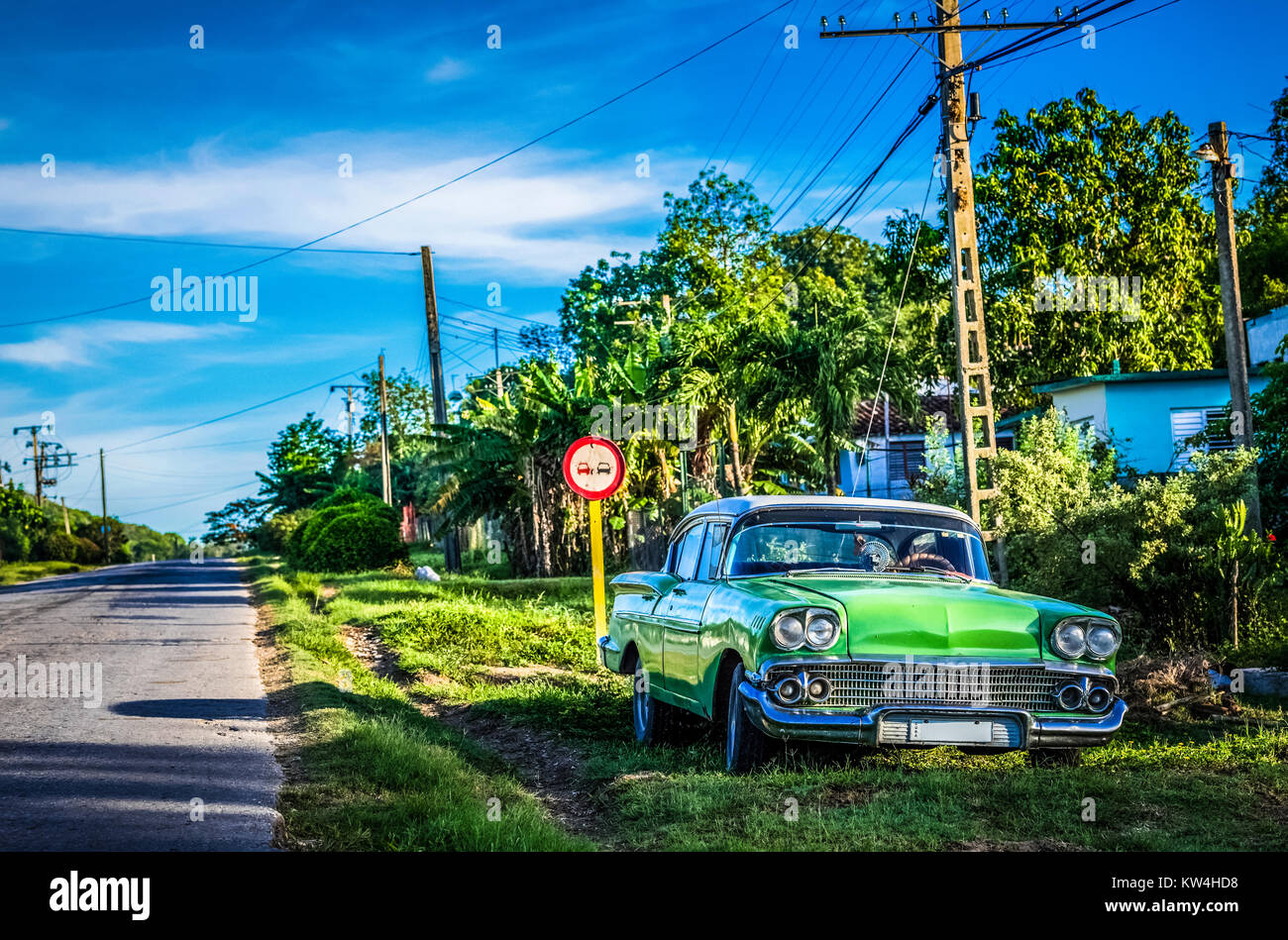 American green Mercury classic car parked on the side strip in Cienfuegos Cuba - Serie Cuba Reportage Stock Photo