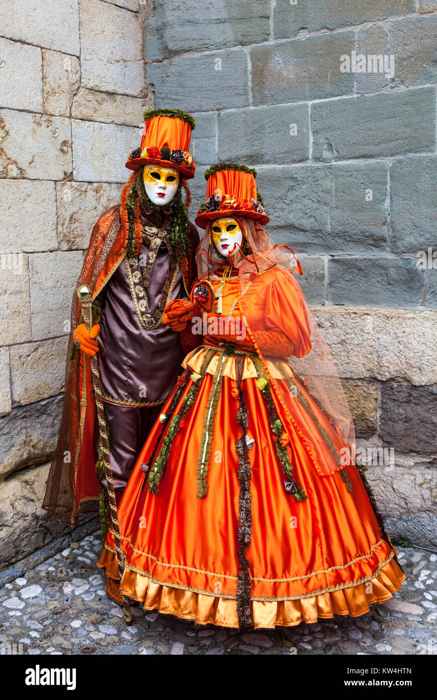Annecy, France, February 23, 2013: Couple disguised in beautiful orange  costumes performing in a street of Annecy, France, during a Venetian  Carnival Stock Photo - Alamy
