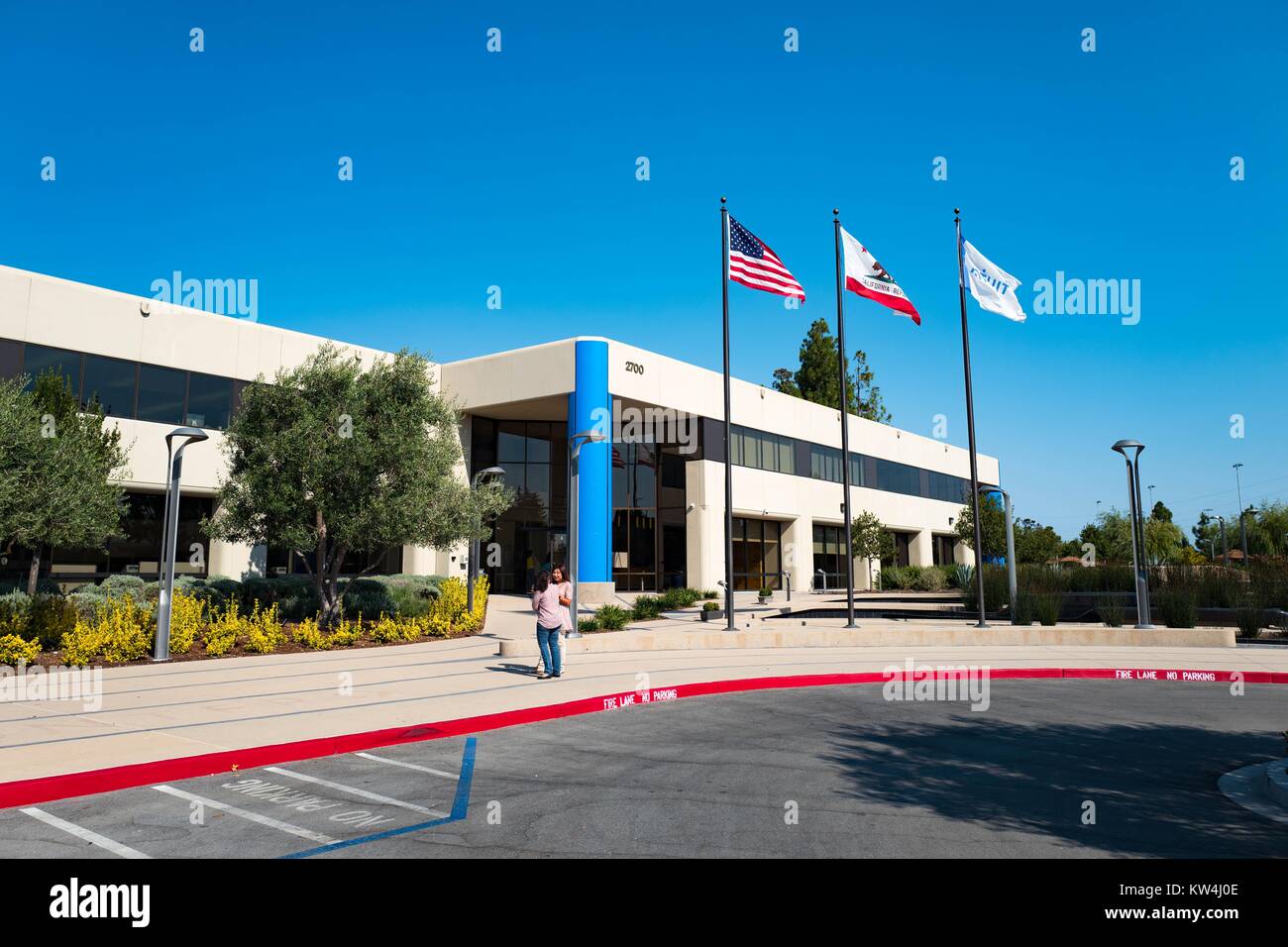 Main building, with American flag, California Republic flag, and Intuit flag, at the headquarters of financial software company Intuit in the Silicon Valley town of Mountain View, California, August 24, 2016. Stock Photo