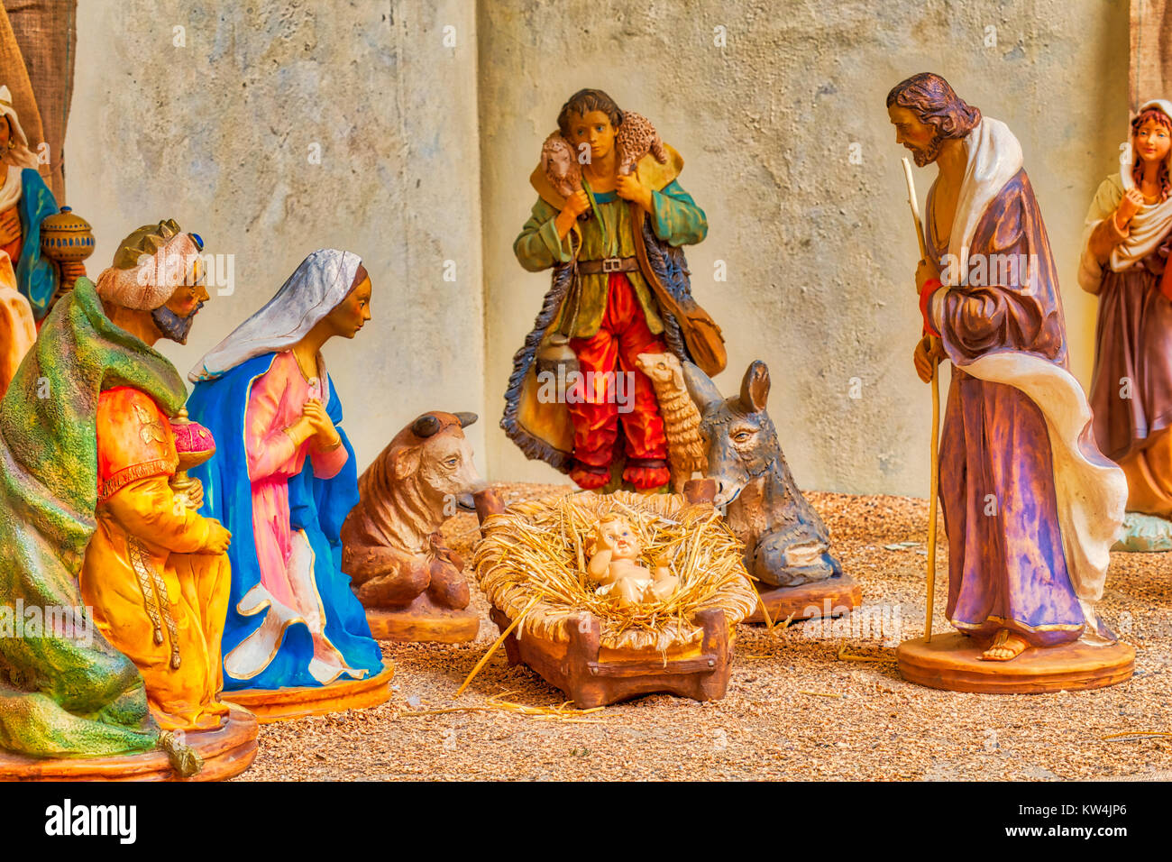 Christmas Nativity scene with shepherd and one of The Three Wise Men visiting The Holy Child 