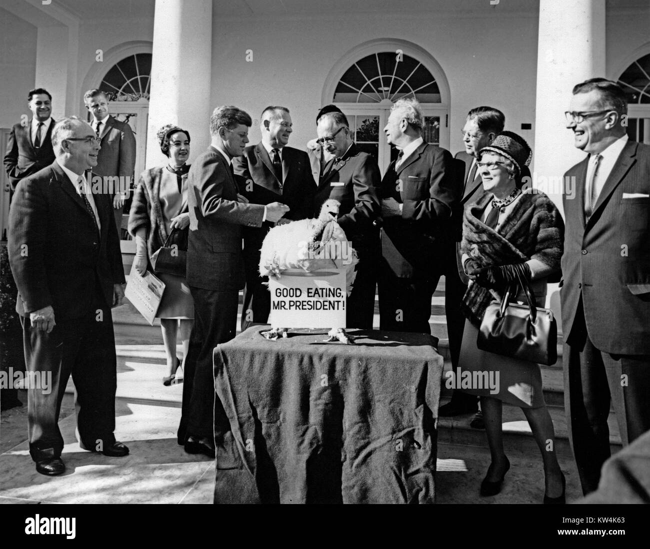 President John F Kennedy and Senator Everett M Dirkson receive a Thanksgiving turkey from the Poultry and Egg National Board at the White House, November 19, 1963. Image courtesy Abbie Rowe/US National Archives. Stock Photo