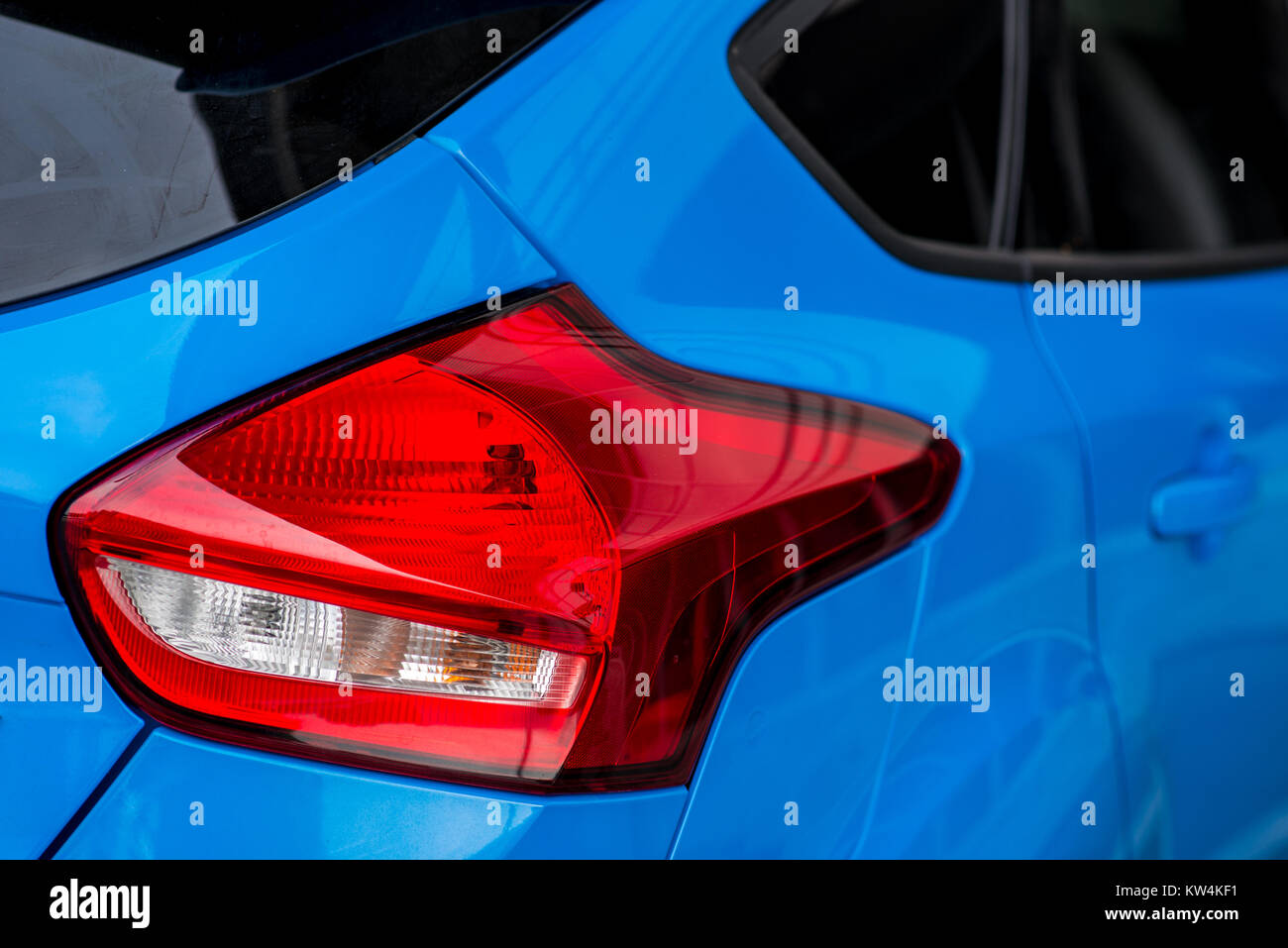 Modern blue polished luxury car red tail lights Stock Photo Alamy