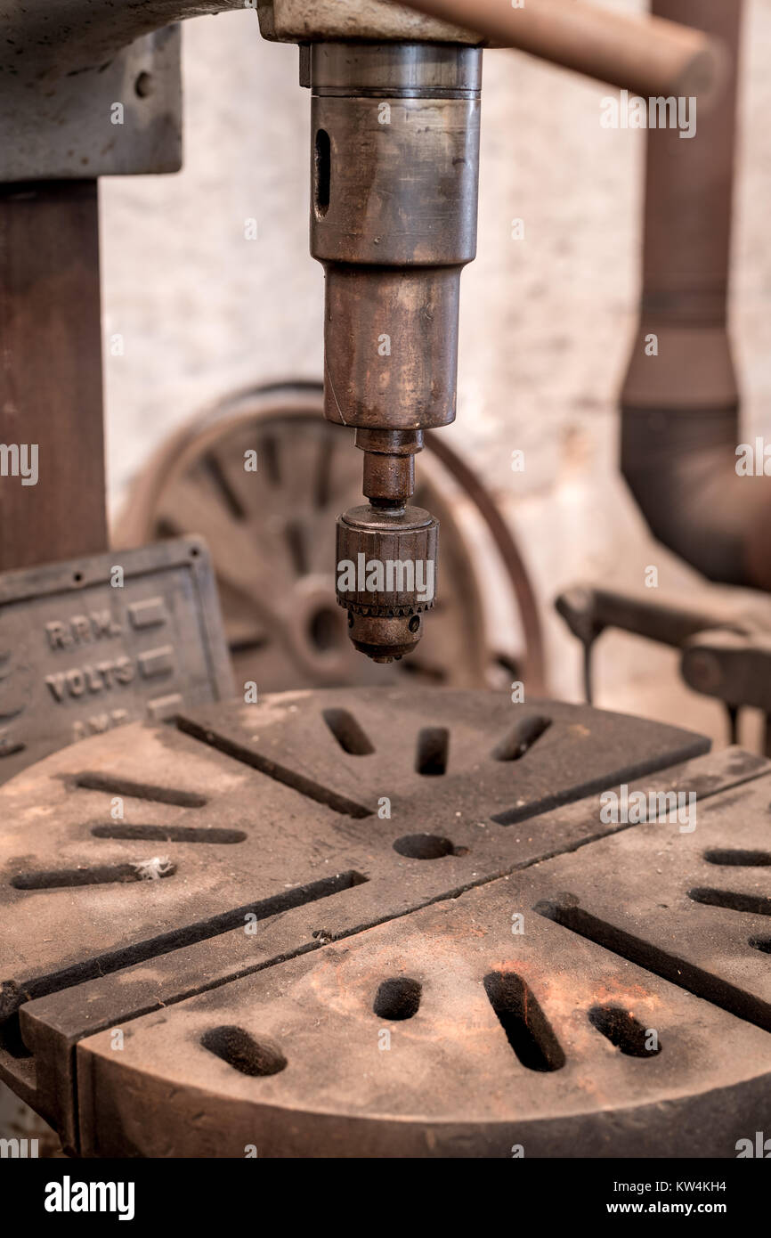 Rusted old drill press with the chuck for bits Stock Photo Alamy