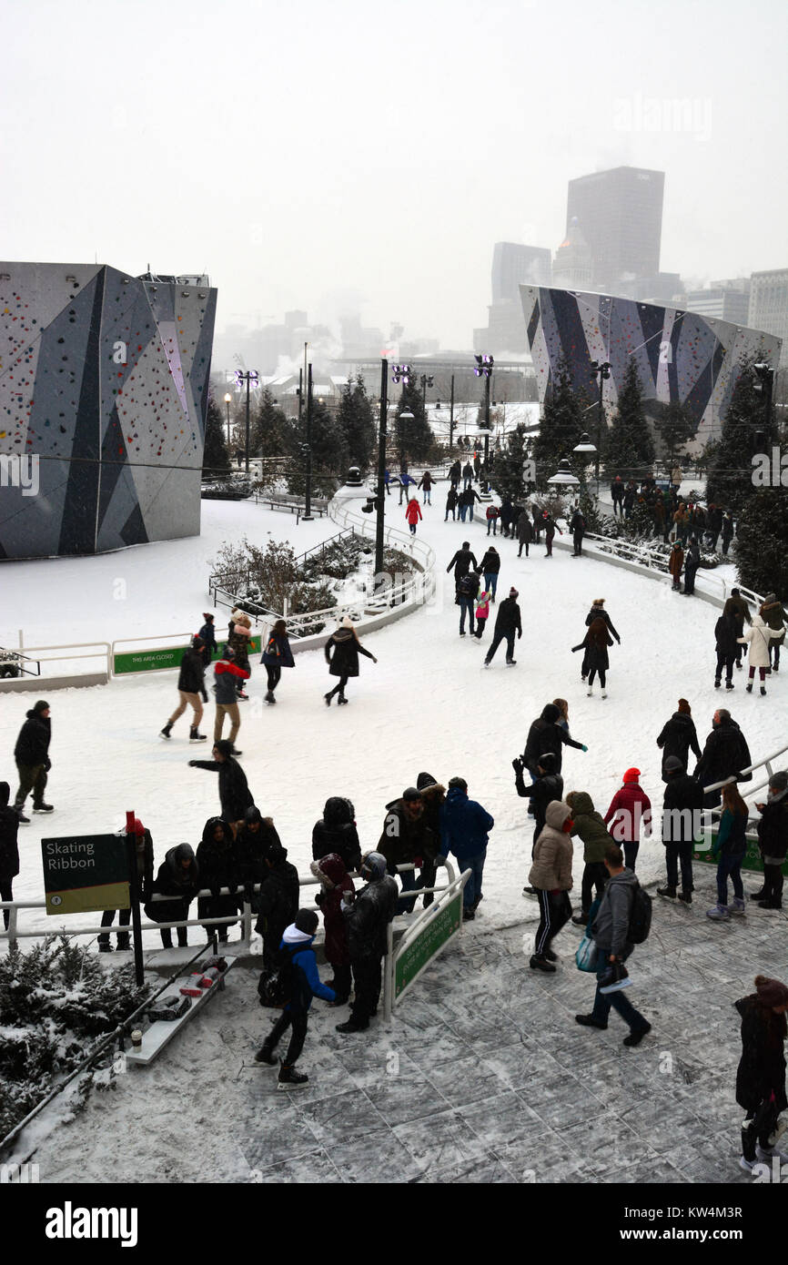 Visitors enjoy outdoor ice skating in the snow at the quarter mile long ...