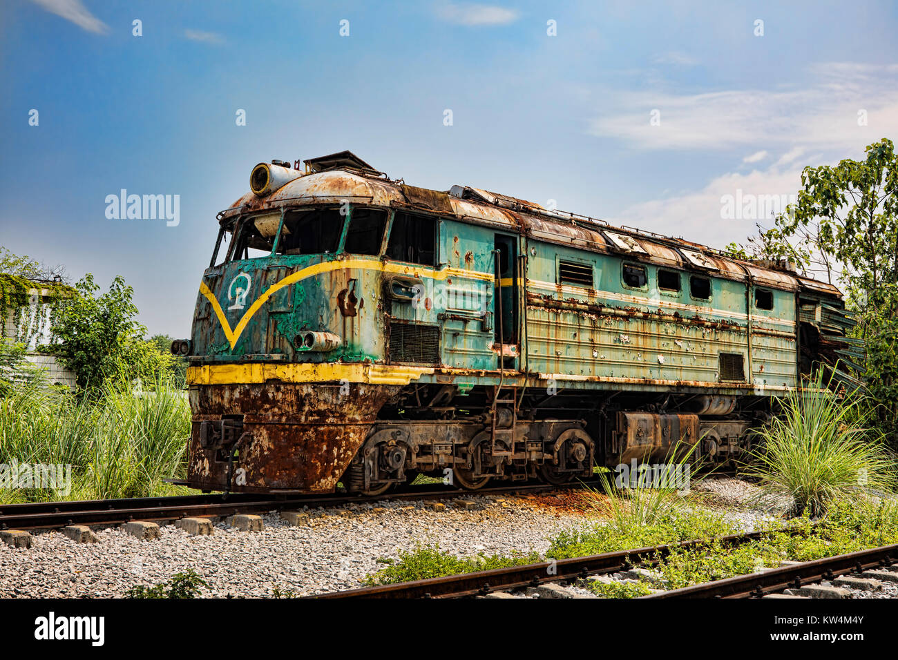An old abandoned train locomotive at a railway station in Guilin, Guangxi Province, China Stock Photo