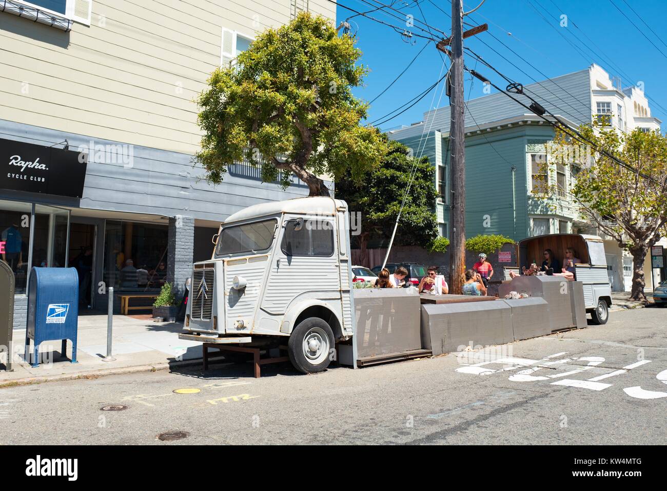 Parklet constructed from an old truck, outside Rapha Cycle Club on a sunny day in the Cow Hollow neighborhood of San Francisco, California, August 28, 2016. Parklets, miniature public parks installed in converted parking spaces, are a popular feature in space-constricted San Francisco. Stock Photo