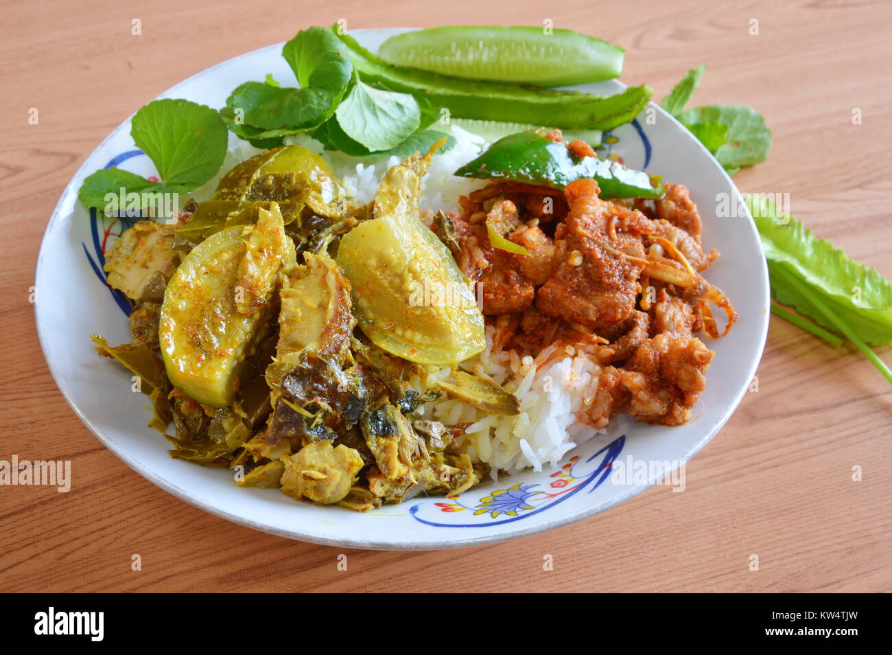green curry with chicken and pork bone on rice Stock Photo Alamy