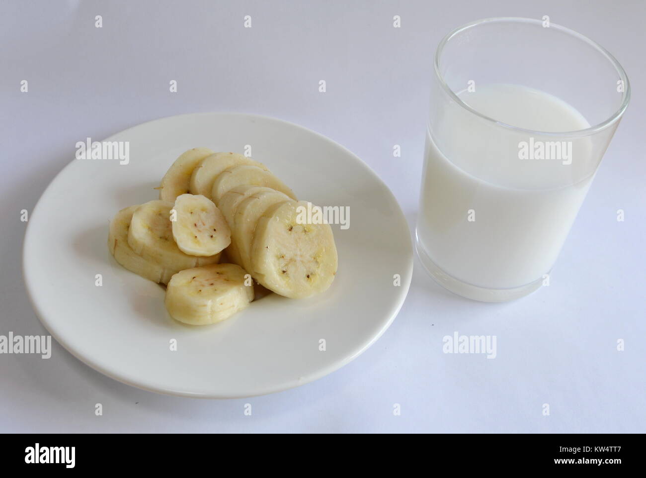 cultivated banana slice and milk glass Stock Photo - Alamy
