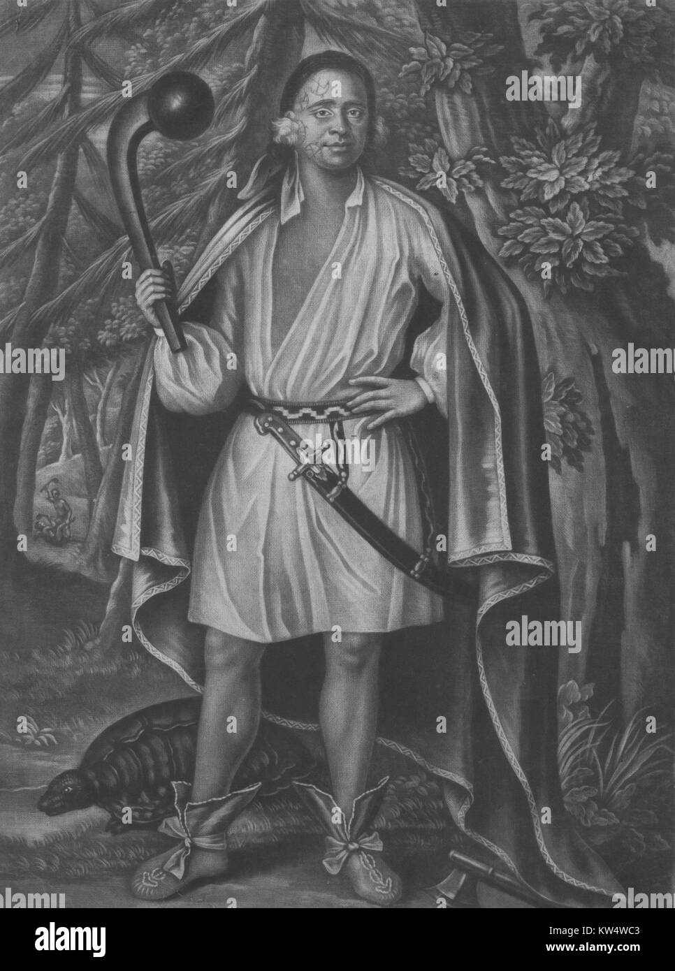 Portrait of Etow Oh Koam, King of the River Nation with tattoos on face, holding up a large club, wearing a hunting shirt and blanket, a large tortoise at his feet, 1710. () Stock Photo