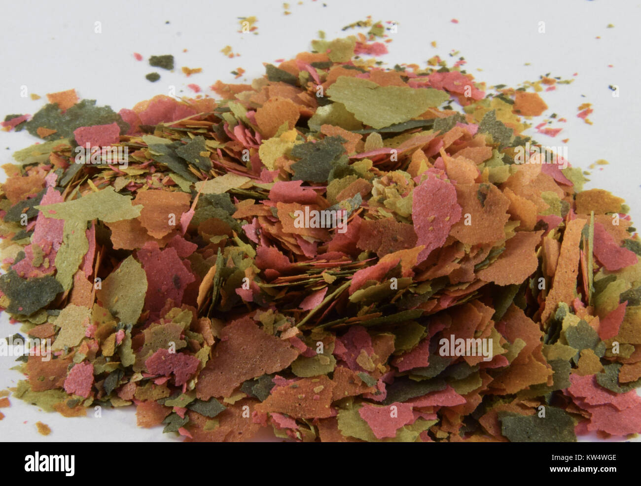 A pile of fish food flakes for tropical fish Stock Photo Alamy