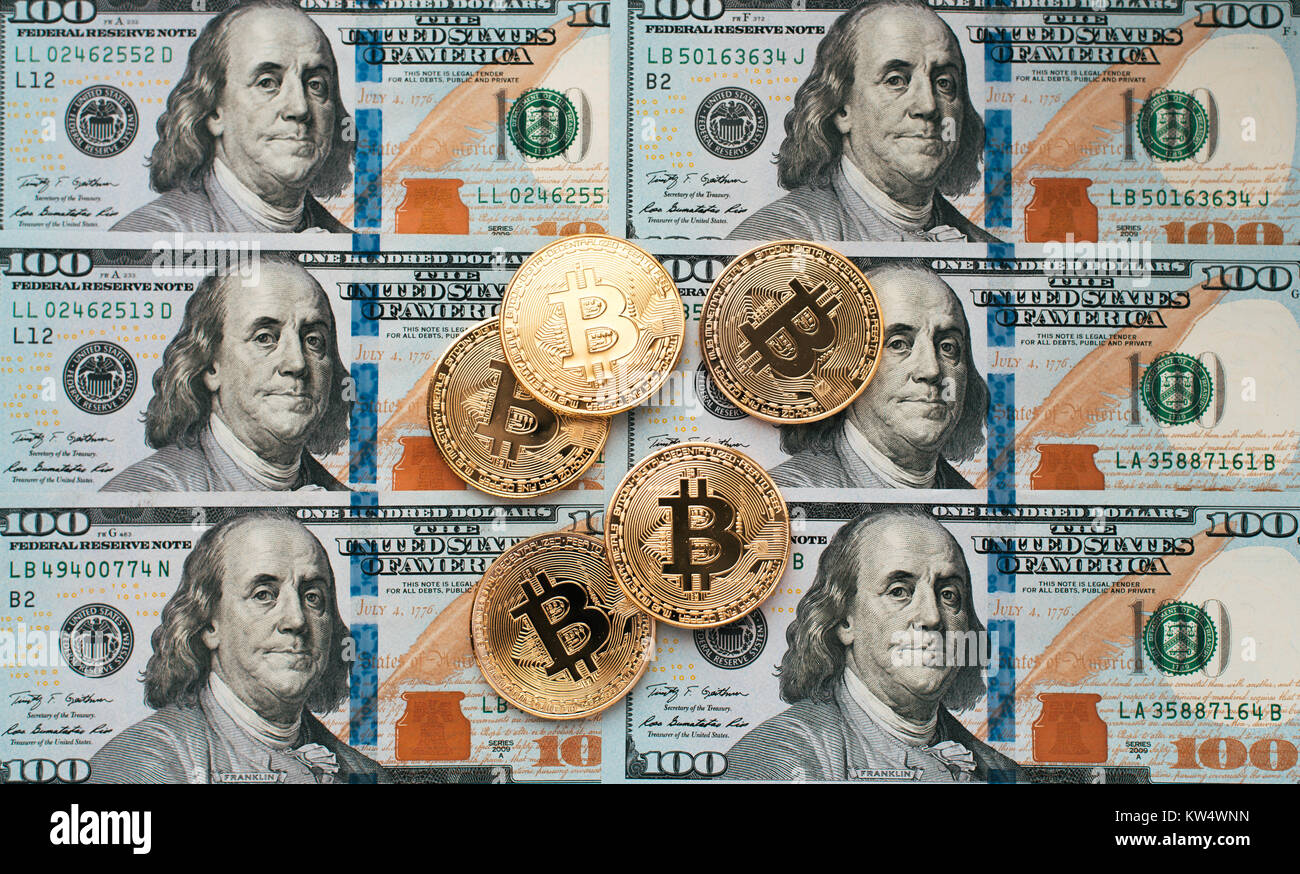 Coins bitcoin, there are money, on the table a note of 100 dollars. The  banknotes are spread out on the table in a loose order of 100 dollars. Gold  co Stock Photo - Alamy
