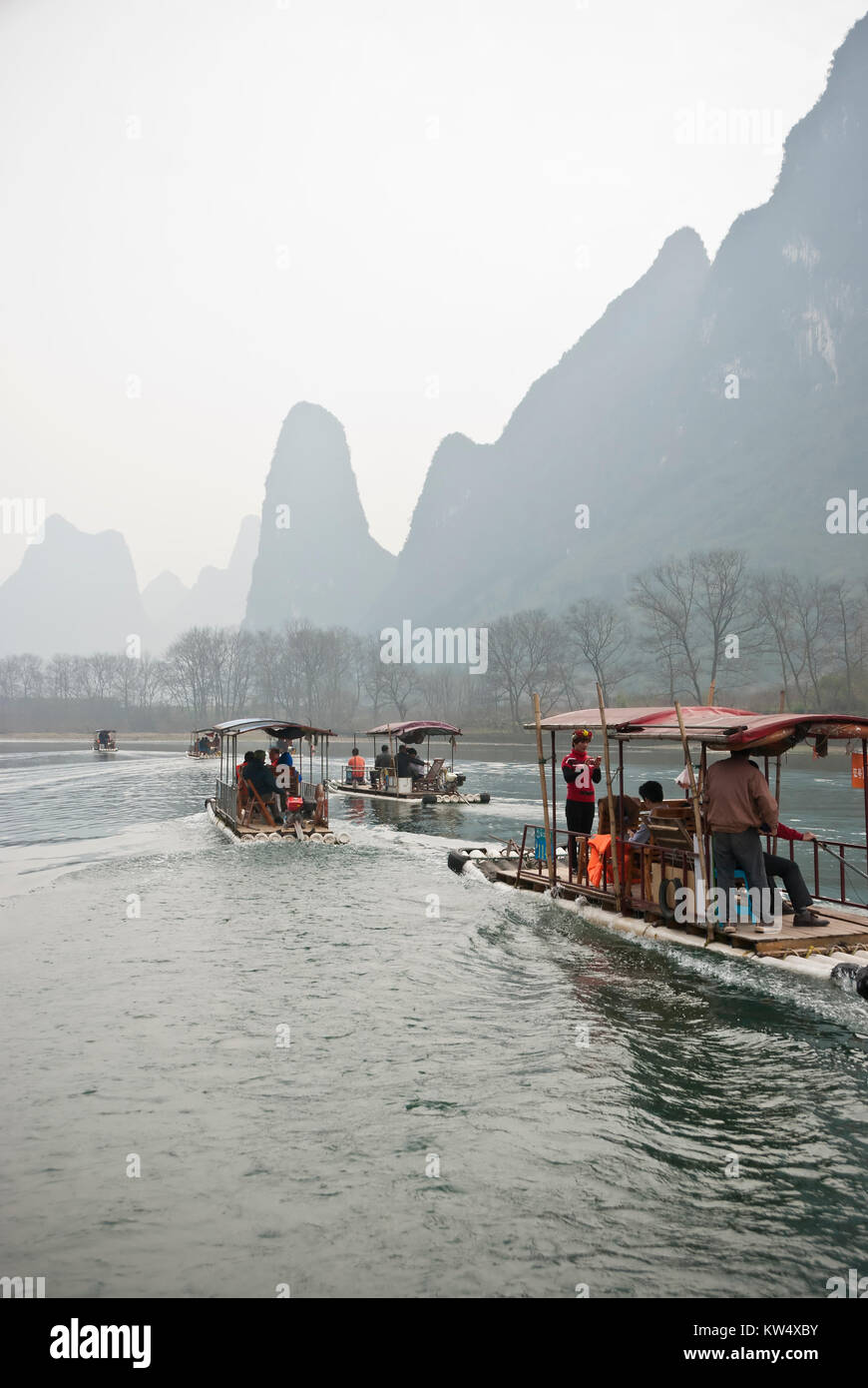 Bamboo Raft in Winter, Li River, Guilin, China  - The Li River or Lijiang is a river in Guangxi Zhuang Autonomous Region, China. Stock Photo