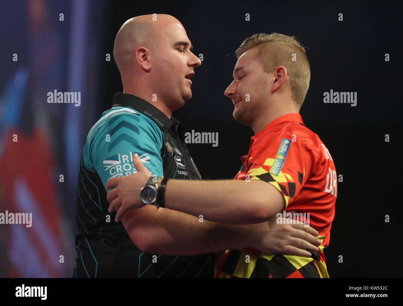 Mursten Rejsende købmand Shaded Dimitri Van den Bergh (right) and Rob Cross during day thirteen of the  William Hill World Darts Championship at Alexandra Palace, London Stock  Photo - Alamy