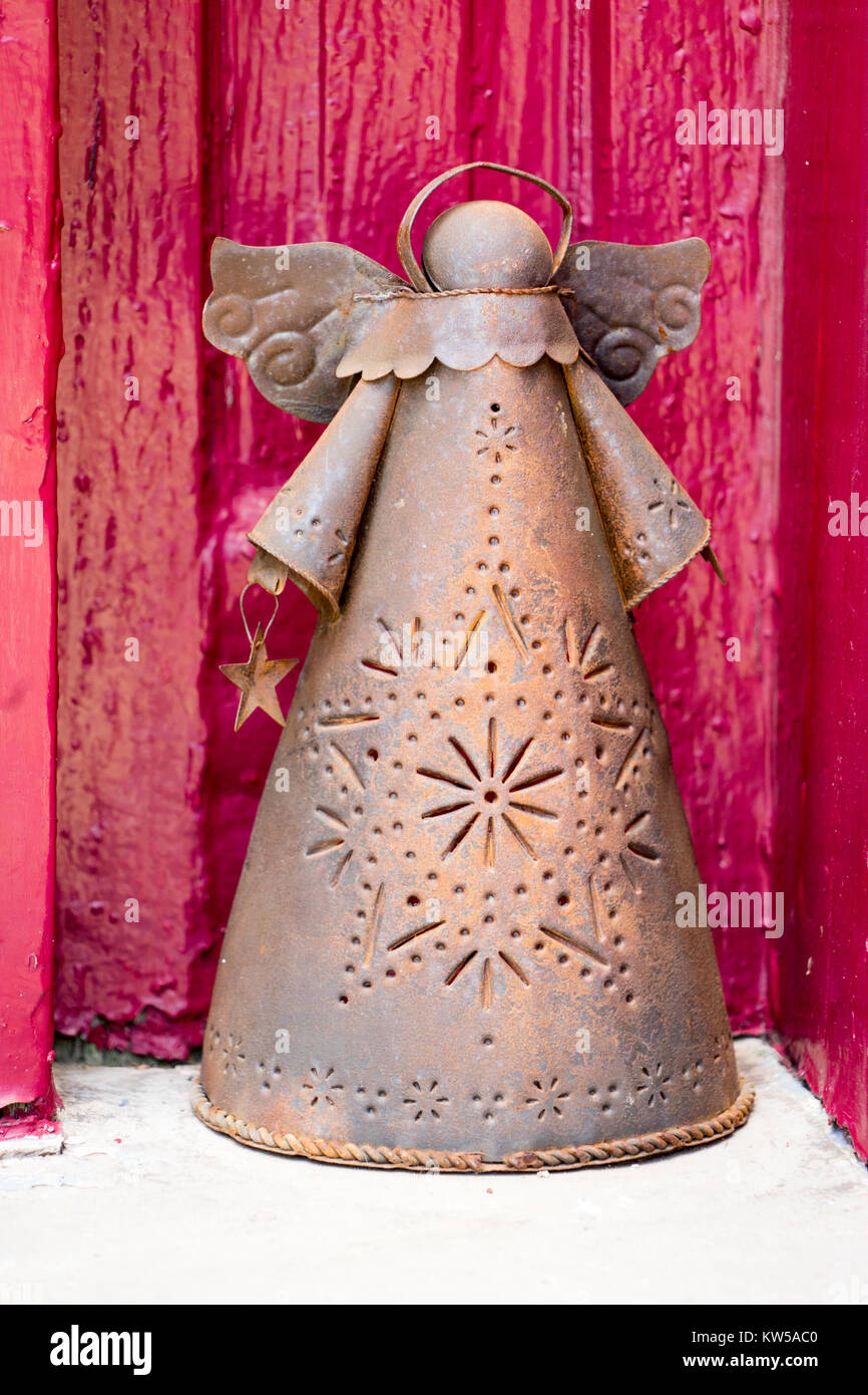 punched-tin-angel-luminaria-on-a-doorstep-in-old-tucson-az-stock-photo