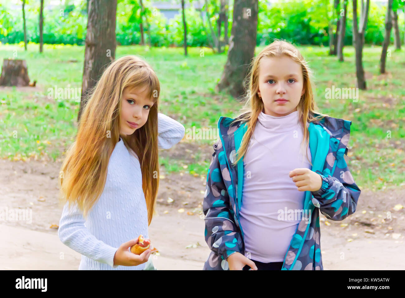 Photo of two cute girls with long hairs Stock Photo - Alamy