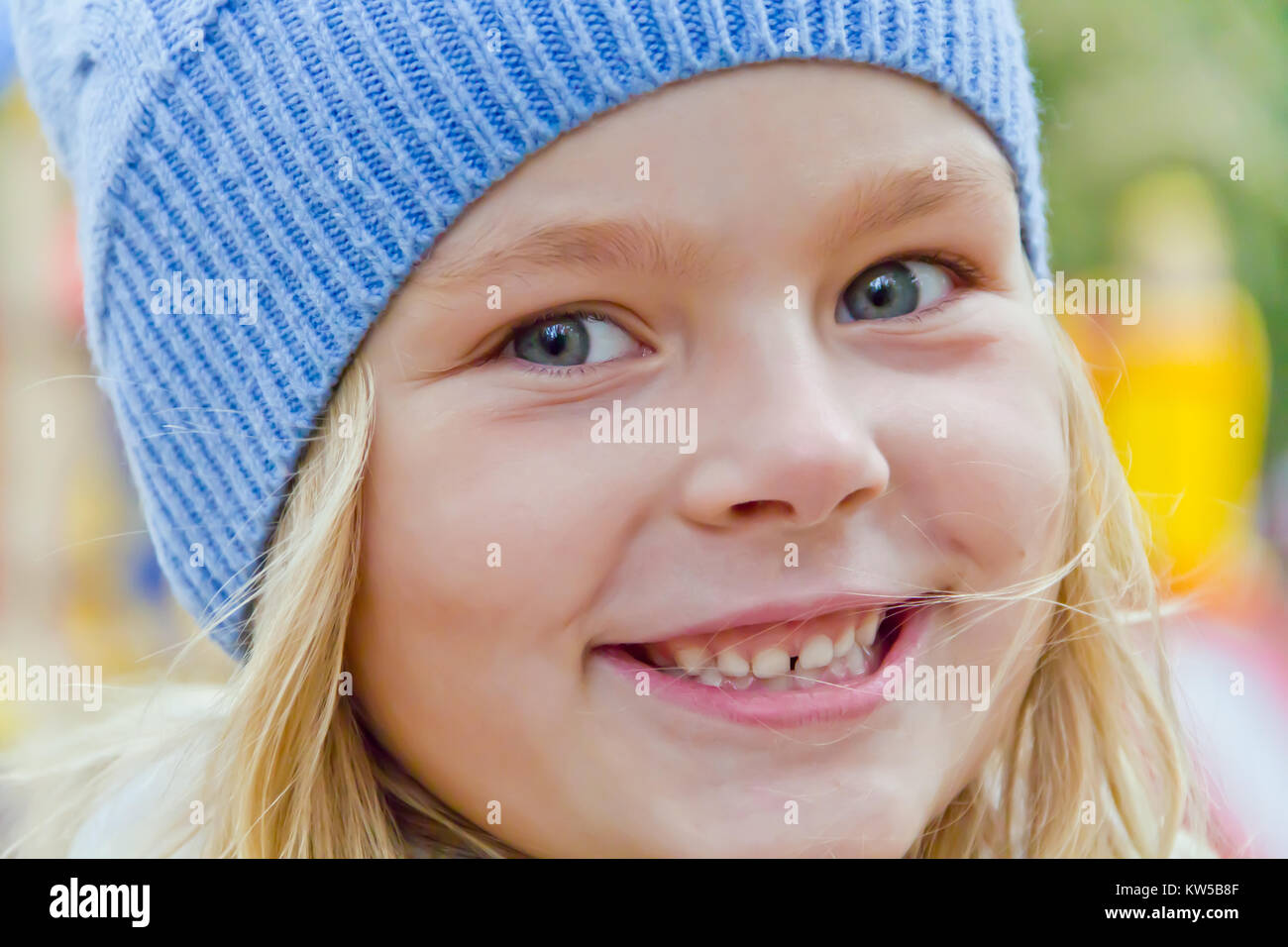 Cute girl with blond long hair and blue eyes Stock Photo - Alamy