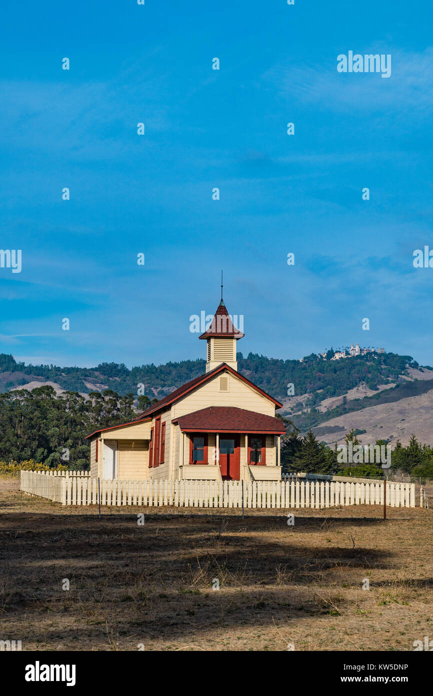 Small church next to Sebastian's store with Hearst Castle high on the mountain in the background. Stock Photo