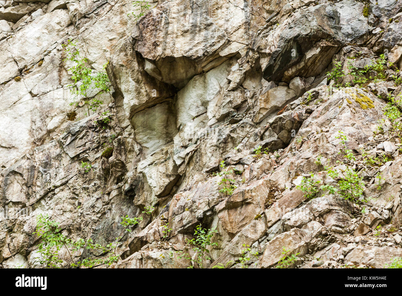 Background of natural stone wall texture rough rock surface Stock Photo ...