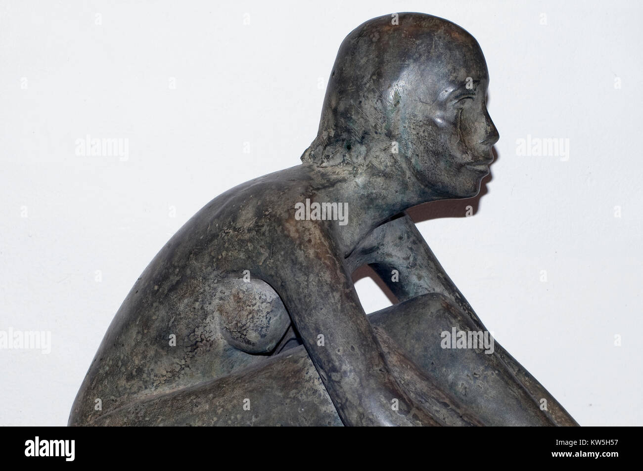 Sculpture of sitting naked female Stock Photo